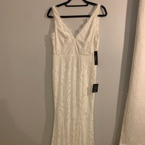Floor length white wedding dress. Never worn